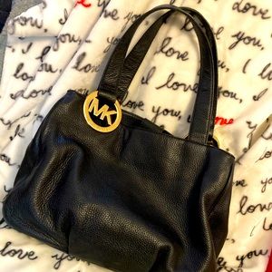 Black Michael kors purse with gold accents